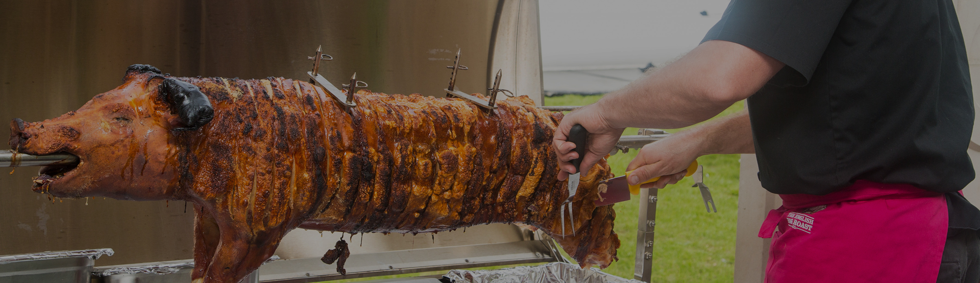 Pig on a spit being hog roasted in Hertfordshire and Essex